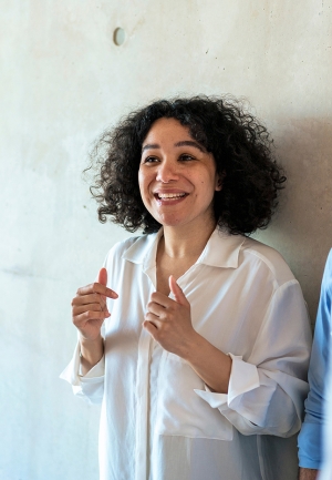 Happy businesswoman discussing with colleagues_high.jpg